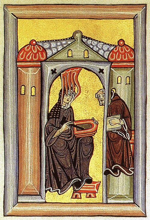 Hildegard von Bingen empfängt eine göttliche Inspiration und gibt sie an ihren Schreiber weiter. Miniatur aus dem Rupertsberger Codex des Liber Scivias, spätes 12. Jh.